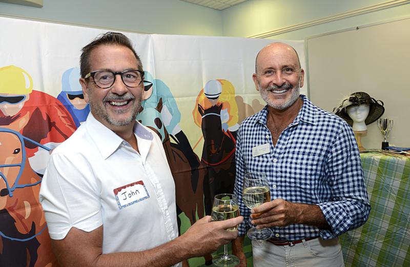 John Mini and CBH board member Robert Perri toast to a successful evening.